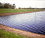 Erosion control on the banks of lakes and reservoirs is acheived with Tensar Mats.